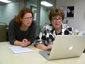 Daisha Walker, MGCCC, and Ellen Ruffin, Curator, de Grummond at USM, research the project.